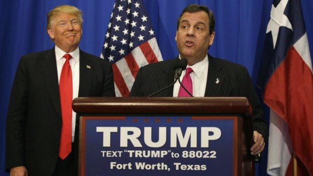 Republican presidential candidate Donald Trump smiles as he stands with New Jersey Governor Chris Christie before a rally in Fort Worth, Texas, on Friday.