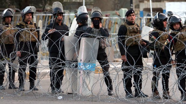 Attacks continue ... Iraqi security forces close a bridge leading to the heavily guarded Green Zone on Friday.