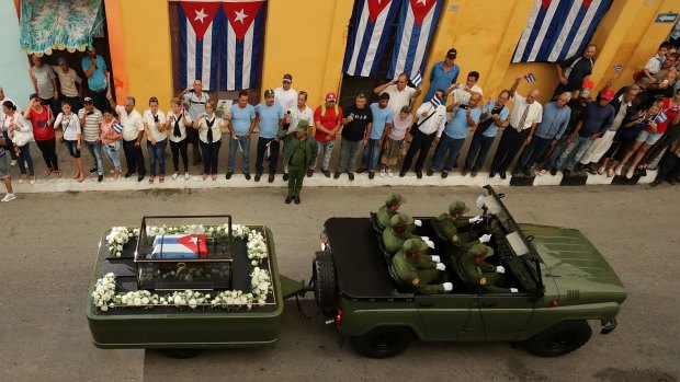 People line the streets to see   Fidel Castro funeral procession.