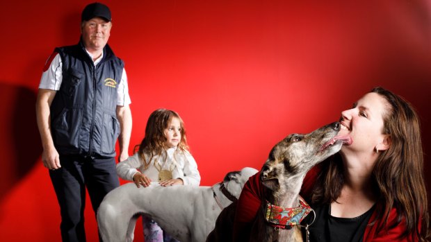 Chairman Canberra Greyhound Racing Club Alan Tutt, three-year-old greyhound fan Kree Gibbs, with retired greyhound Porsha, and Martina Taliano, co-ordinator of Canberra Region Greyhound Connections Group with retired greyhound Sadie. 