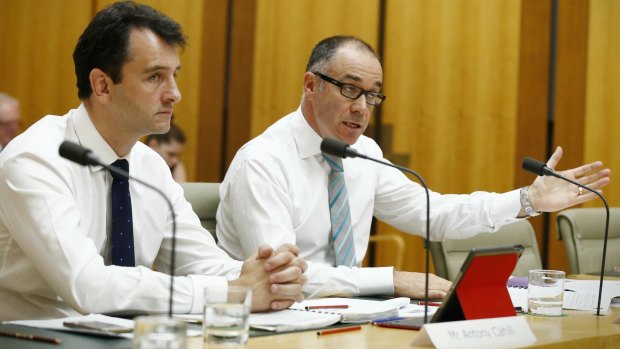 National Australia Bank chief executive Andrew Thorburn (right) and chief operating officer Antony Cahill have faced a testy hearing at Parliament.