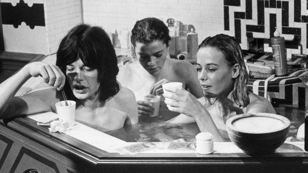 Mick Jagger, left, enjoys a bath with Michele Breton and Anita Pallenberg in the film <i>Performance</I>.