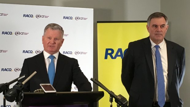 QT Mutual Bank chief executive Steve Targett and RACQ Group chief executive Ian Gillespie announce their merger to create a new banking entity.