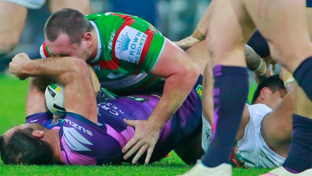 The incident: Cameron Smith shortly after his boot made contact with the head of South Sydney hooker Issac Luke (bottom right)