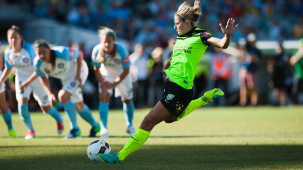 Multitalented: Ellie Brush scores a penalty for Canberra United in the W-League.