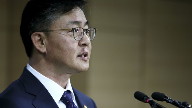 South Korean Unification Minister Hong Yong-pyo announces the suspension of the Kaesong industrial complex operations on Wednesday.