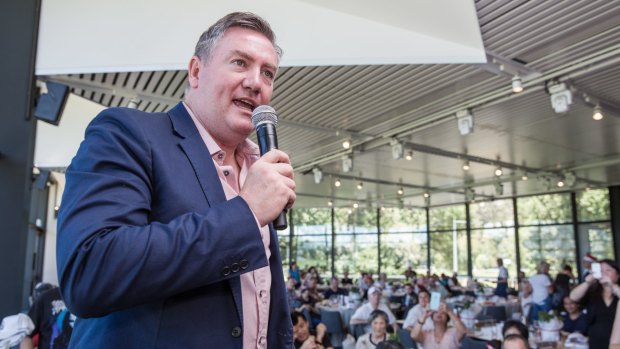 Eddie McGuire has called for those behind the anti-Muslim banner to be banned for life.