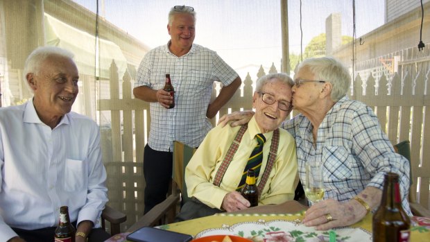 After Monday's court victory, Norm Bravo shares a celebration beer with his wife Beth, son-in-law Ron Crawford (left) and friend Alan Thornton.