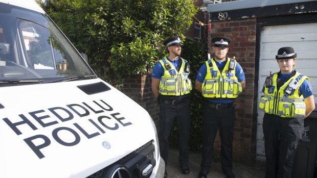Police outside a property in Pentwyn, Cardiff.