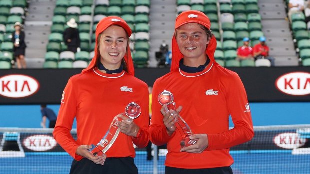 Zoe Carr (left) and Sam McLachlan get their moment of glory after being named the top ballkids of this year's Open.