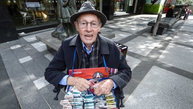 Graham Malloch selling Anzac pins in Melbourne.