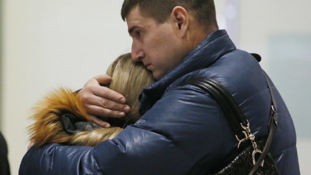 Relatives react after a Russian airliner with more than 200 passengers crashes in Egypt.