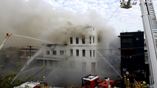 Firefighters battle the blaze engulfing the Albion Hotel on October 5, 2015.