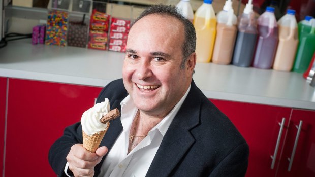 Stan Gordon, CEO of Franchised Food Company, poses for a photo with a soft serve ice cream.