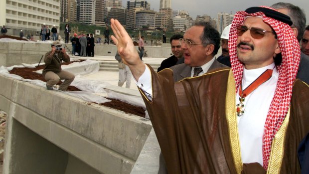 Saudi Prince Alwaleed bin Talal gestures as he tours his construction site, a $US140 million hotel, on the Beirut sea front in 2002. 