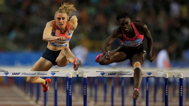 Sally Pearson, left, and Dawn Harper-Nelson compete in 2013. 