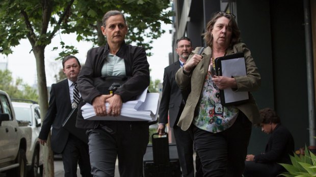 AFP officers enter the headquarters of the AWU in Spencer Street. 