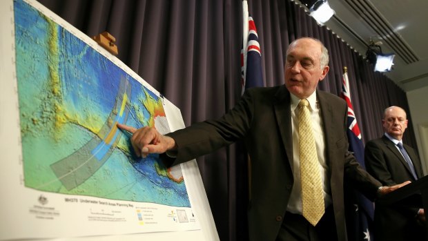 Deputy Prime Minister Warren Truss shows the search zone for MH370 during a press conference in June 2014. 