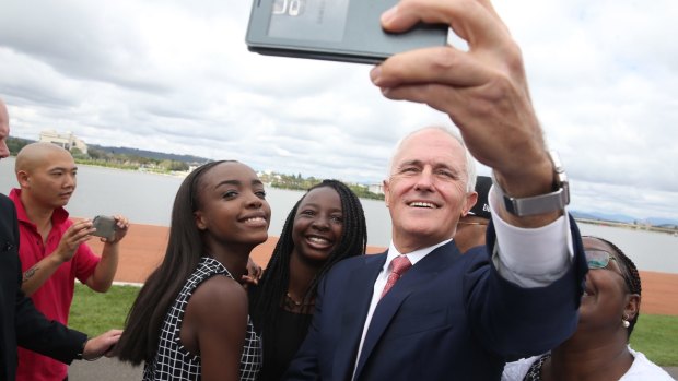 Malcolm Turnbull takes a selfie with new Australian citizens Lydia Banda-Mukuka and Chilandu Kalobi Chilaika on Australia Day last year.