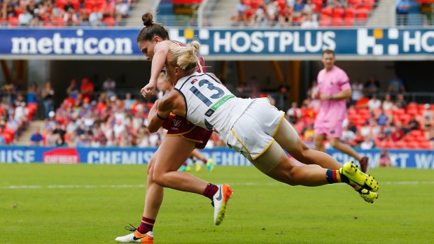 Erin Phillips of the Crows tackles Emily Bates.
