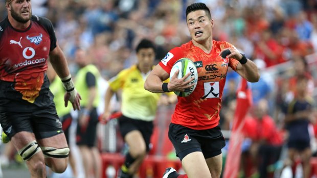 On the run: Akihito Yamada of the Sunwolves makes a break and scores.