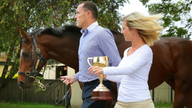 New home: Jamie Lovett and his wife, Kellie, show off Cup winner Protectionist.