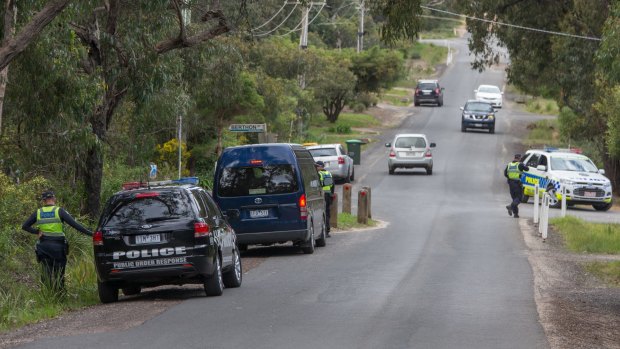 Police scour the streets near the Curry family holiday home on Thursday.