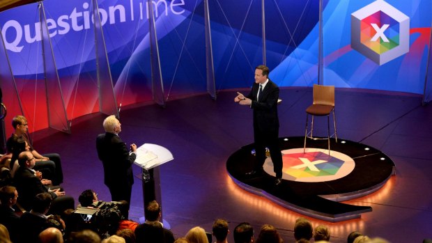 David Cameron takes part in a special BBC Question Time program, hosted by David Dimbleby (standing left) on Thursday, with the three main party leaders appearing separately. 