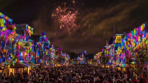 Fireworks explode over Main Street at Disneyland as part of PixarFest.
