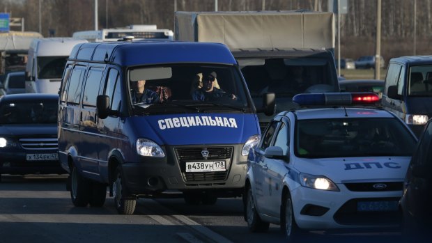 A van carrying plane crash victims en route to a facility where identification procedures are held in St Petersburg, Russia, on Tuesday.