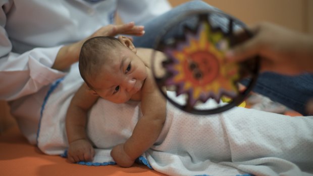 Three-month-old Daniel, who was born with microcephaly, undergoes physical therapy at the Altino Ventura foundation in Recife, Brazil. 