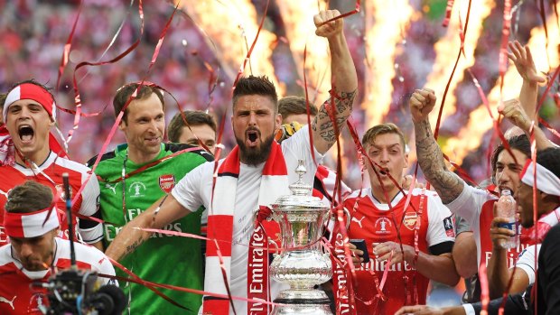 On fire: Arsenal players celebrate their FA Cup victory over Chelsea in May.