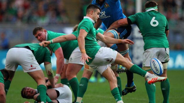 Conor Murray unleashes a box kick against Italy.