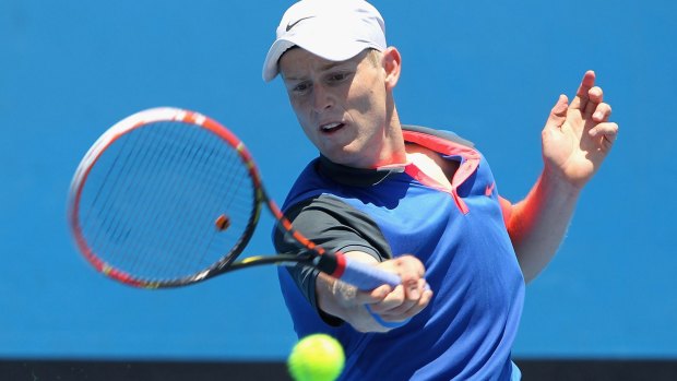 Luke Saville plays a forehand against Christopher O'Connell during the Australian Open wildcard playoffs.