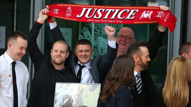 Relatives of the Hillsborough victims celebrate as they depart Birchwood Park after hearing the conclusions of the Hillsborough inquest.