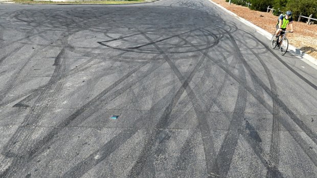 Skid marks from hoons doing burn outs mark the roads in a Melbourne industrial estate. 
