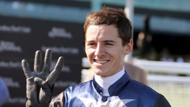 Jason Collett gestures after winning his fourth race of the day at Randwick in January.