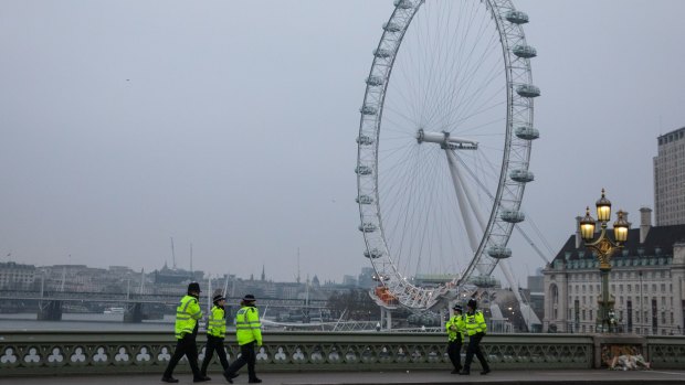 The strong police presence on Westminster Bridge after it opened to the public again on Friday.
