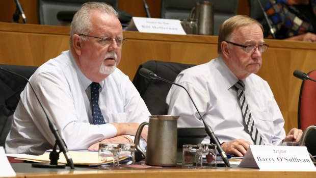 Senators Barry O'Sullivan and Ian Macdonald.