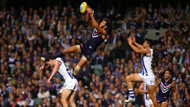PERTH, AUSTRALIA - MAY 23: Zac Clarke of the Dockers sets for a mark during the round eight AFL match between the Fremantle Dockers and the North Melbourne Kangaroos at Domain Stadium on May 23, 2015 in Perth, Australia.  (Photo by Paul Kane/Getty Images)