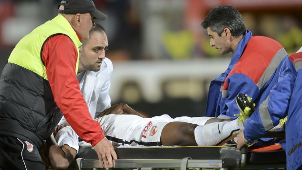 Dinamo's Patrick Ekeng of Cameroon is placed on a stretcher after collapsing during a match.