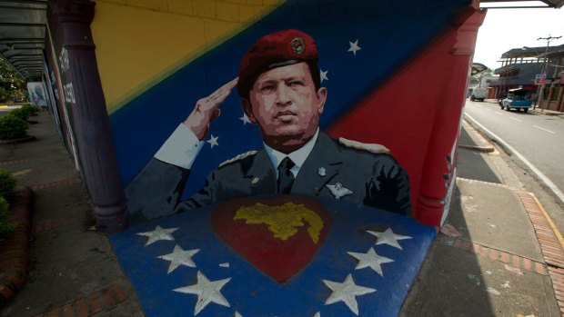 A mural to Venezuela's late President Hugo Chavez decorates the main entrance of his home town, in Sabaneta, Venezuela. 