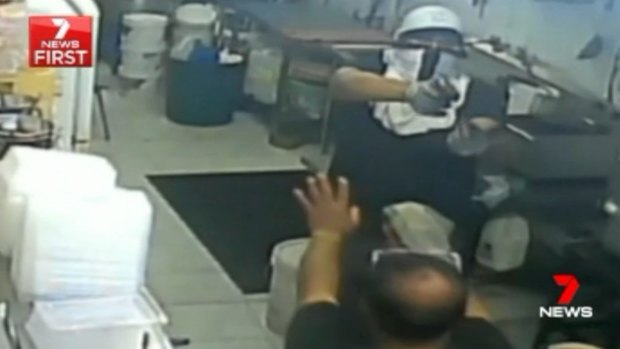 Footage shows the gunman pointing a pistol at Mr Tanvir and the chef, before they were forced into a refrigerated storeroom.