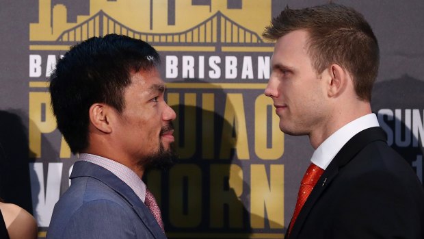 'Stay down': Jeff Horn, right, has received a warning from Manny Pacquiao's corner man before the Sunday fight at Suncorp Stadium.