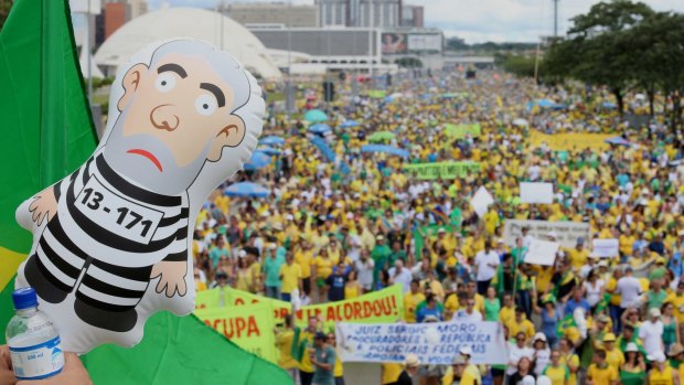 A sea of green and yellow: people demonstrate against President Dilma Rousseff and the ruling Workers Party (PT) in Brasilia on March 13.