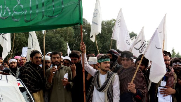 Nangarhar University students raise Taliban and Islamic State flags during a demonstration in Jalalabad earlier this    month. 