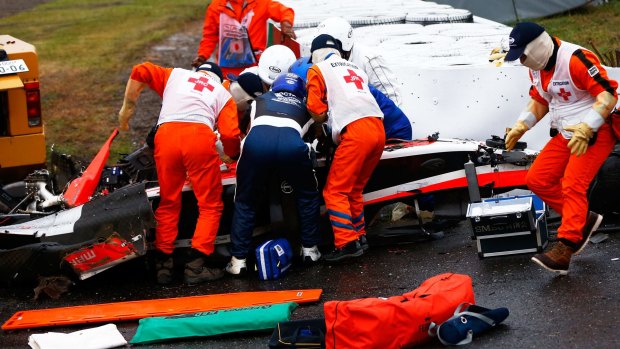 High impact: Jules Bianchi of France and Marussia receives urgent medical treatment after crashing during the Japanese  Grand Prix in October. 
