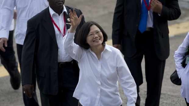 Taiwan's President Tsai Ing-wen, centre, waves as she visits the Miraflores locks, one of three locks that form part of the Panama Canal in Panama City.