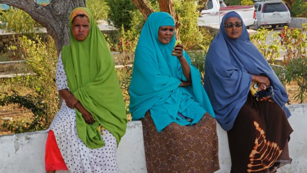 Somali women wait for news of their missing relatives outside a hospital ward in Mogadishu two days after the attack.