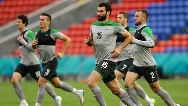It's about the team, not me: Skipper Mile Jedinak trains with the Socceroos at Hunter Stadium on Monday.